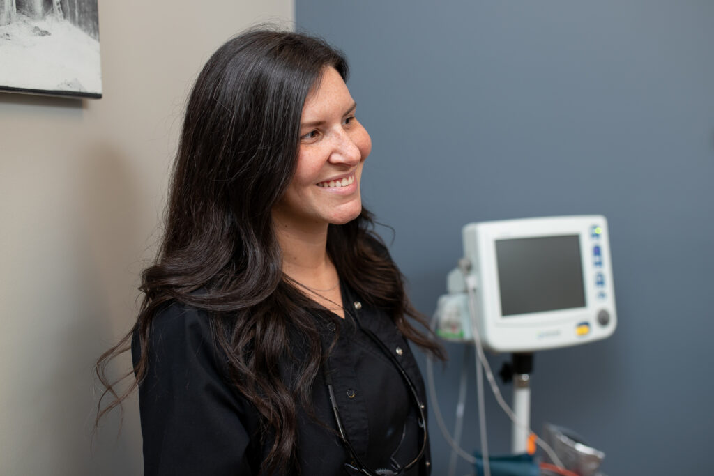 surgical assistant smiling while in a discussion