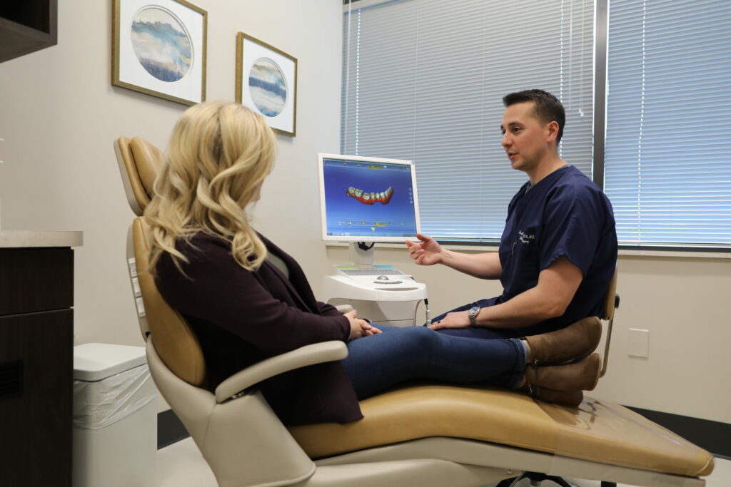 doctor talking with a patient and showing her a diagram