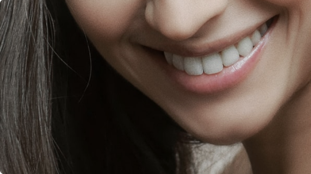 woman's mouth smiling and showing her beautiful healthy teeth